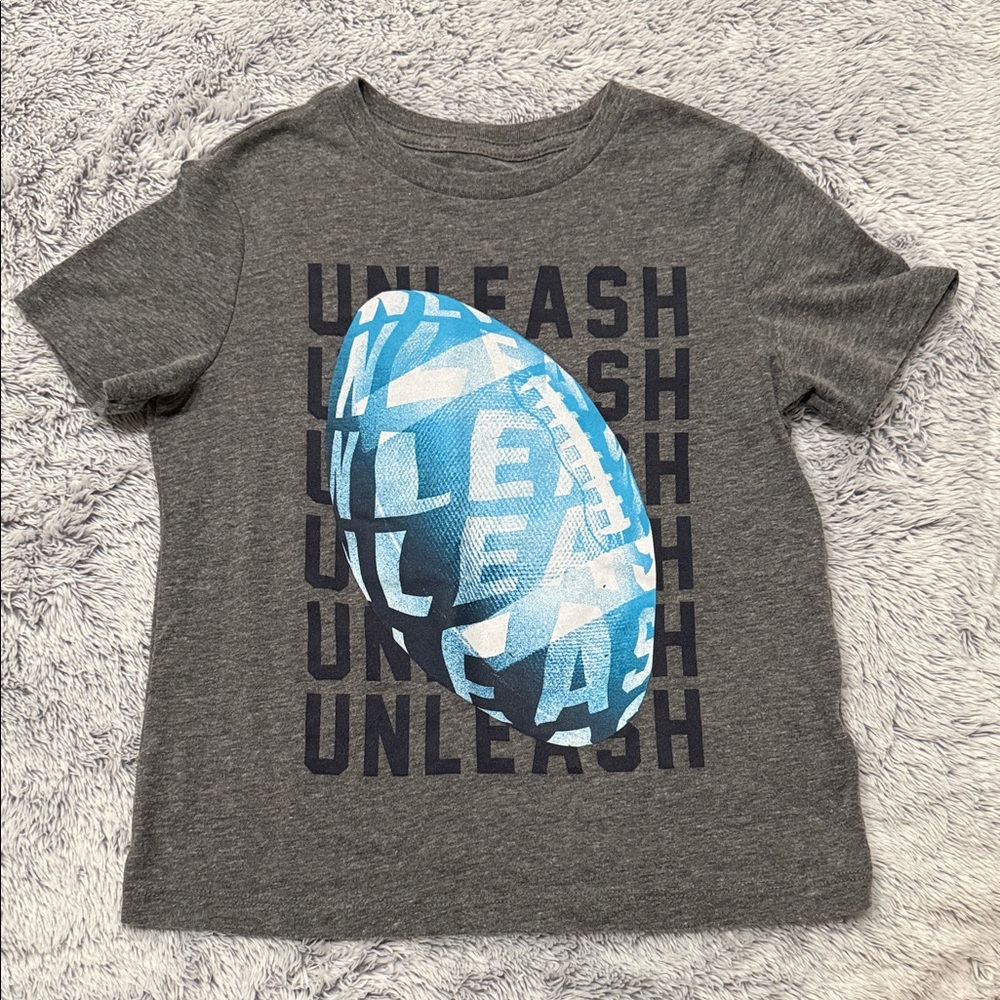 Football T-shirt boys size 6-7.